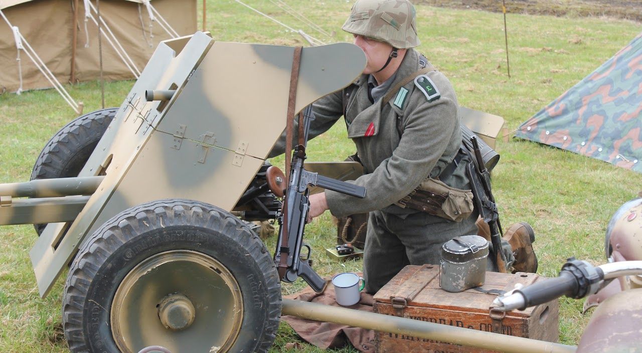 A member in Panzer Lehr uniform crewing a 3.7 cm PaK 36 anti-tank gun