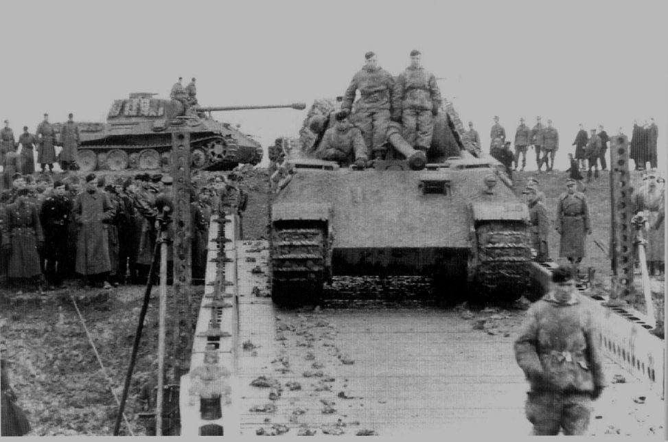 A Panther tank of the Panzer Lehr Division crossing a pontoon bridge